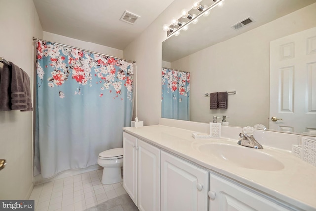 bathroom with visible vents, tile patterned flooring, vanity, and toilet
