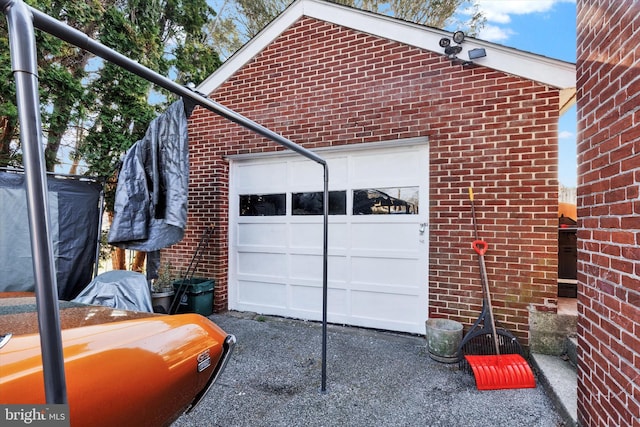 garage featuring driveway