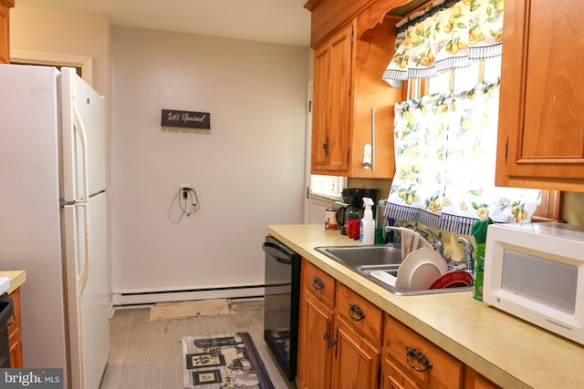 kitchen featuring a sink, baseboard heating, white appliances, brown cabinets, and light countertops