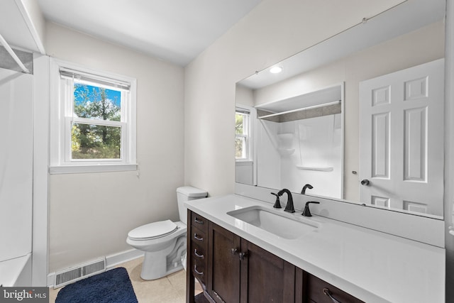 full bathroom featuring vanity, tile patterned floors, toilet, visible vents, and a shower