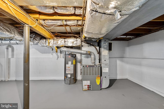 unfinished basement featuring gas water heater and heating unit