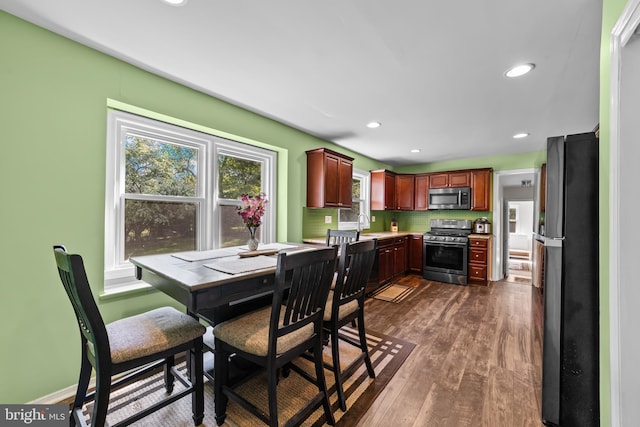 dining room featuring dark wood-style flooring and recessed lighting