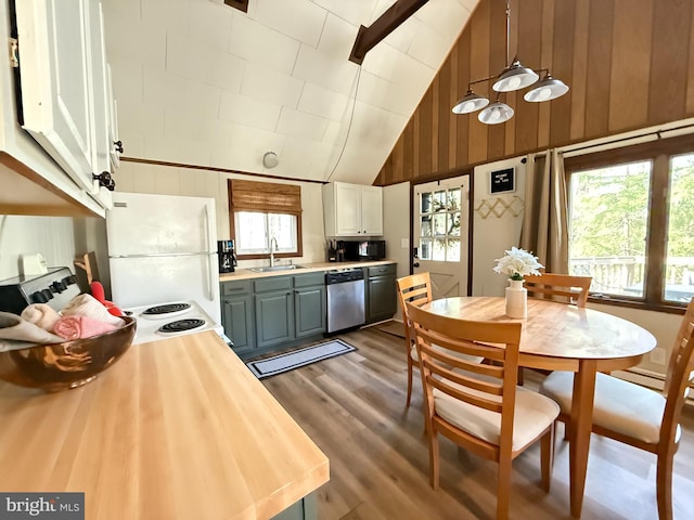 437 Orono Dr, Pocono Lake, PA 18347 - kitchen with a sink, dishwasher, wood walls, freestanding refrigerator, and wood finished floors