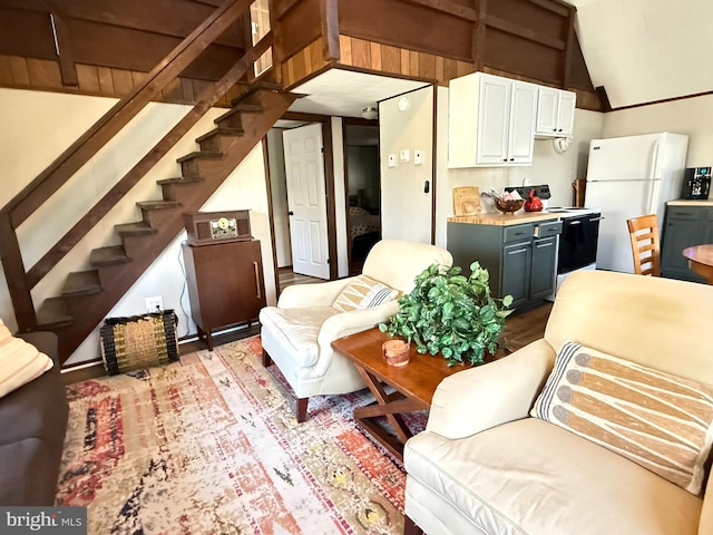 437 Orono Dr, Pocono Lake, PA 18347 - living area with lofted ceiling and stairway
