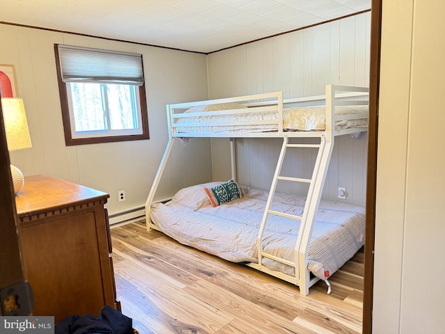 437 Orono Dr, Pocono Lake, PA 18347 - bedroom featuring ornamental molding, a decorative wall, and wood finished floors