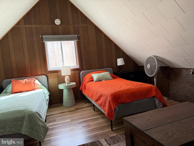 437 Orono Dr, Pocono Lake, PA 18347 - bedroom featuring light wood finished floors, wood walls, and lofted ceiling