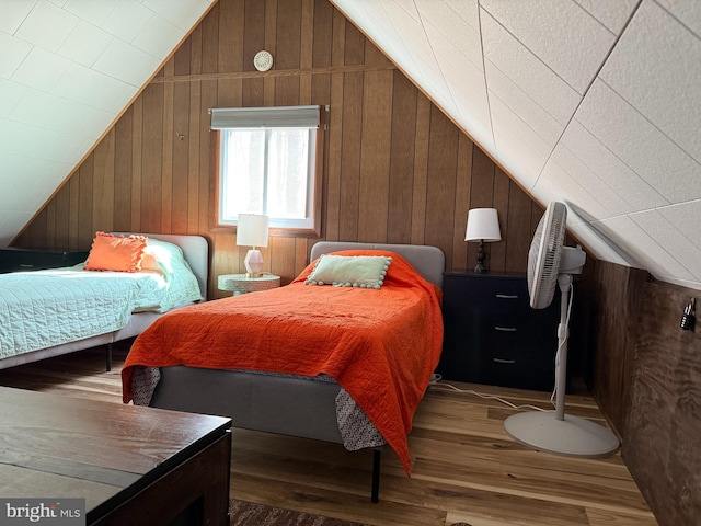 437 Orono Dr, Pocono Lake, PA 18347 - bedroom with wood walls, wood finished floors, and vaulted ceiling