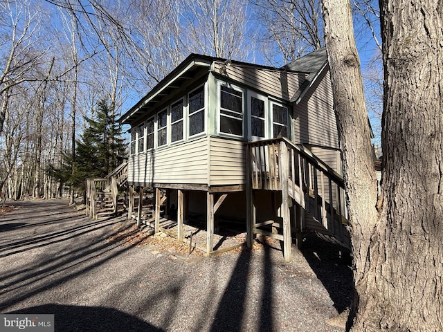 437 Orono Dr, Pocono Lake, PA 18347 - view of side of home featuring stairway
