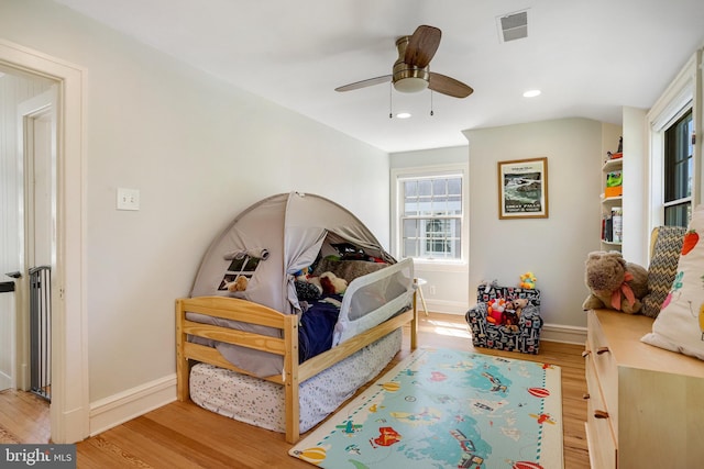 bedroom with recessed lighting, baseboards, visible vents, and light wood-type flooring