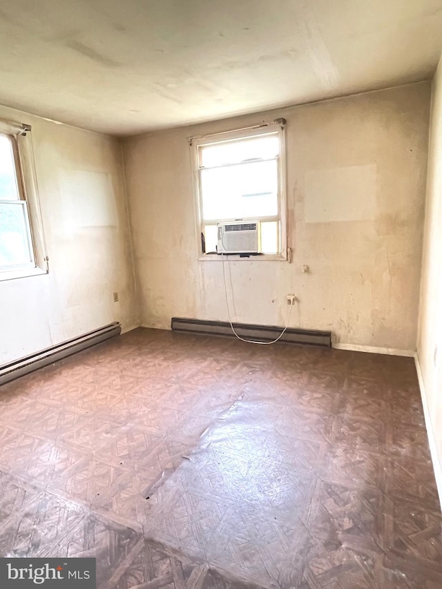 5781 N Timber Ridge Rd, Berkeley Springs, WV 25411 - empty room with baseboard heating, cooling unit, a wealth of natural light, and a baseboard radiator