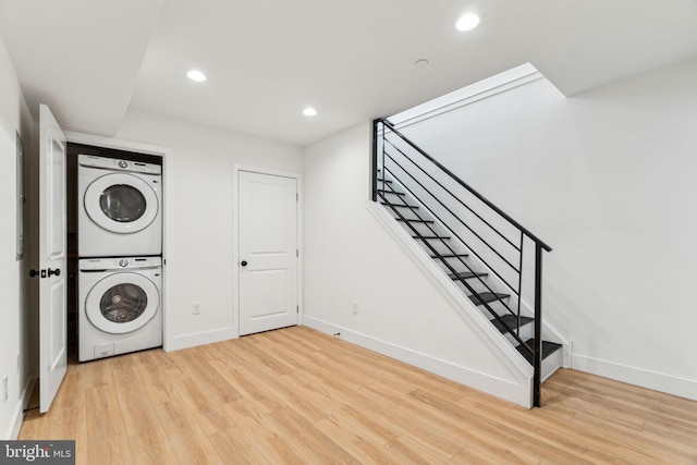 1810 Federal St Unit 1, Philadelphia, PA 19146 - washroom with stacked washer and clothes dryer, wood finished floors, baseboards, and recessed lighting