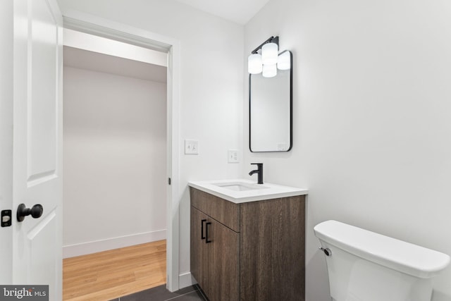 1810 Federal St Unit 1, Philadelphia, PA 19146 - bathroom featuring vanity, wood finished floors, toilet, and baseboards