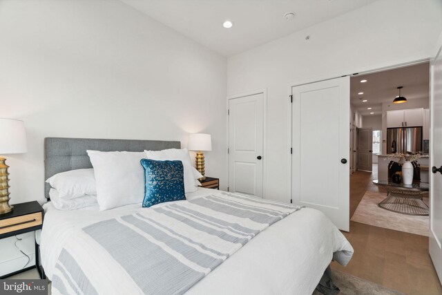 1810 Federal St Unit 1, Philadelphia, PA 19146 - bedroom featuring freestanding refrigerator, wood finished floors, and recessed lighting