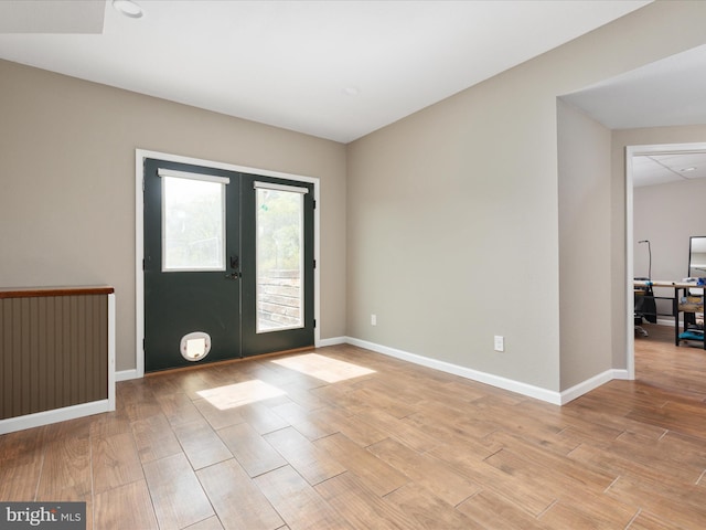 4437 Stonewall Jackson Hwy, Bentonville, VA 22610 - entrance foyer with french doors, baseboards, and light wood-style floors