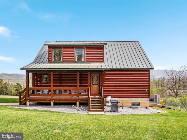4437 Stonewall Jackson Hwy, Bentonville, VA 22610 - rear view of property with fence, a standing seam roof, a lawn, and metal roof