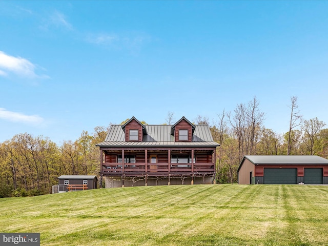 4437 Stonewall Jackson Hwy, Bentonville, VA 22610 - view of front of home with an outbuilding, a front yard, a detached garage, and metal roof