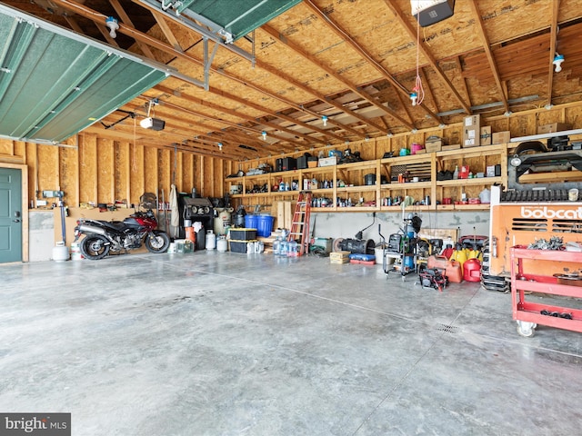 4437 Stonewall Jackson Hwy, Bentonville, VA 22610 - garage featuring a workshop area and a garage door opener