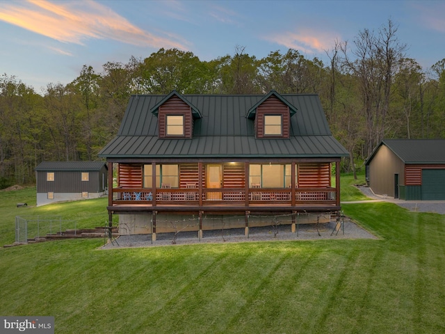 4437 Stonewall Jackson Hwy, Bentonville, VA 22610 - back of property at dusk featuring a standing seam roof, an outdoor structure, a yard, and metal roof