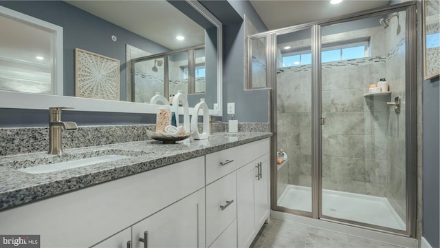 6825 Winterhill Ln, Glen Burnie, MD 21060 - bathroom featuring a shower stall, a sink, double vanity, and recessed lighting