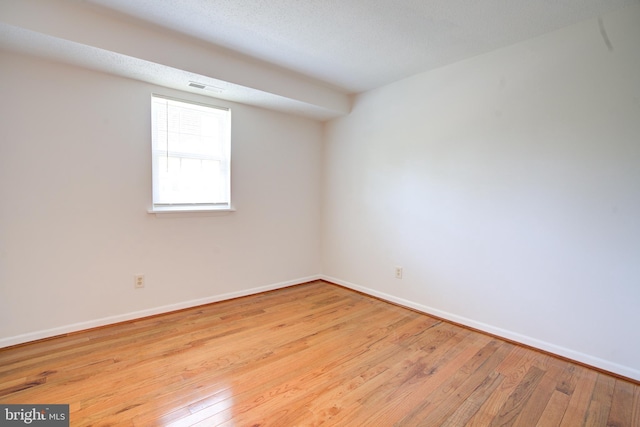 11902 Tarragon Rd Unit J, Reisterstown, MD 21136 - empty room with visible vents, baseboards, and hardwood / wood-style flooring