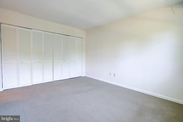11902 Tarragon Rd Unit J, Reisterstown, MD 21136 - unfurnished bedroom with dark carpet, baseboards, and a closet
