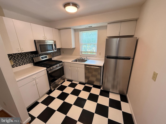 11902 Tarragon Rd Unit J, Reisterstown, MD 21136 - kitchen featuring a sink, light floors, appliances with stainless steel finishes, and light countertops