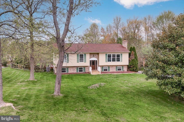 128 Pinion Pl, Bear, DE 19701 - raised ranch with a chimney, a front lawn, fence, and brick siding