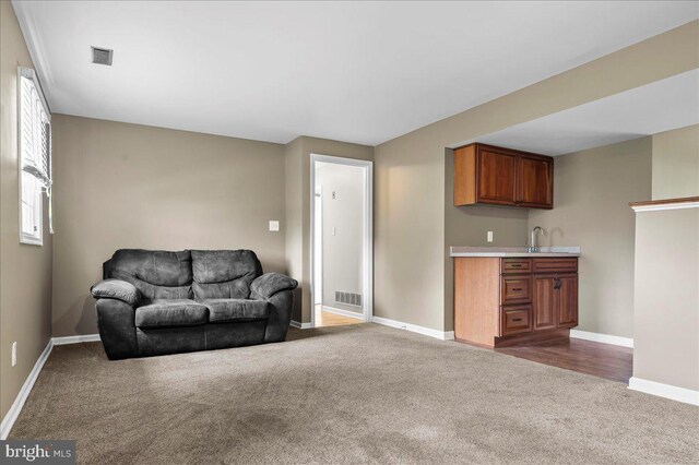 128 Pinion Pl, Bear, DE 19701 - living room featuring dark colored carpet, visible vents, and baseboards