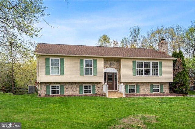 128 Pinion Pl, Bear, DE 19701 - raised ranch featuring a chimney, brick siding, fence, and a front yard