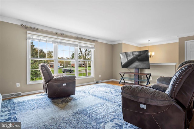 128 Pinion Pl, Bear, DE 19701 - living room featuring baseboards, ornamental molding, visible vents, and an inviting chandelier