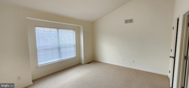 335 Paradee Dr, Dover, DE 19904 - carpeted empty room with plenty of natural light and vaulted ceiling