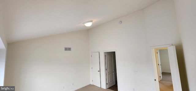 335 Paradee Dr, Dover, DE 19904 - unfurnished bedroom featuring carpet flooring and high vaulted ceiling