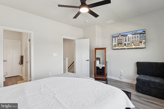 7828 Yona Ct, Glen Burnie, MD 21060 - bedroom with wood finished floors, baseboards, ensuite bath, and ceiling fan