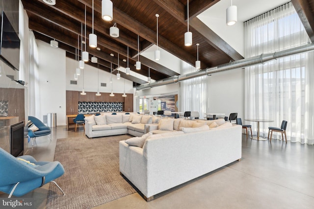 7828 Yona Ct, Glen Burnie, MD 21060 - living room with a high ceiling, beam ceiling, wood ceiling, and concrete flooring