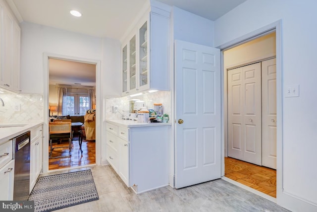 3275 Sutton Pl NW Unit C, Washington, DC 20016 - interior space featuring tasteful backsplash, dishwasher, white cabinetry, and light countertops