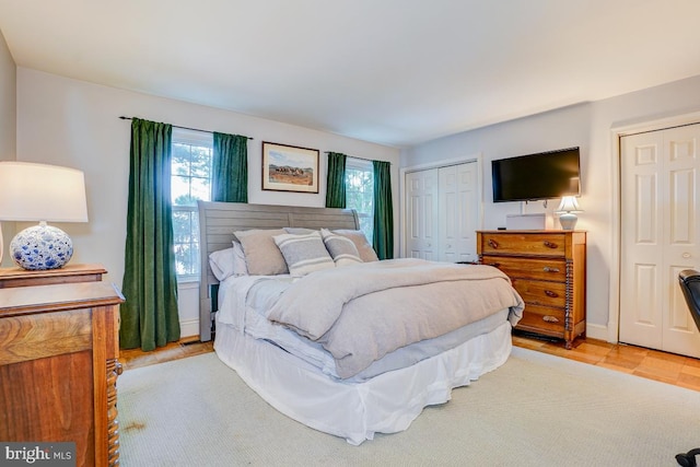 3275 Sutton Pl NW Unit C, Washington, DC 20016 - bedroom with baseboards and two closets