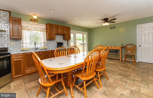 dining space featuring visible vents, a ceiling fan, recessed lighting, and a brick fireplace