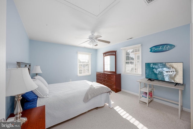 bedroom featuring visible vents, baseboards, attic access, carpet flooring, and ceiling fan