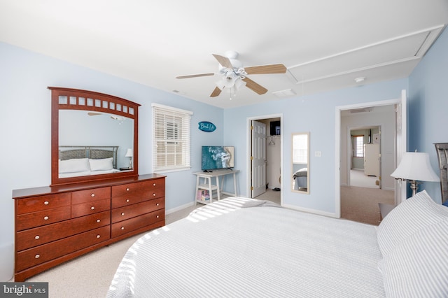 bedroom featuring attic access, ceiling fan, baseboards, and light colored carpet