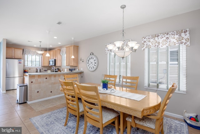 dining room featuring recessed lighting, an inviting chandelier, visible vents, light tile patterned flooring, and baseboards