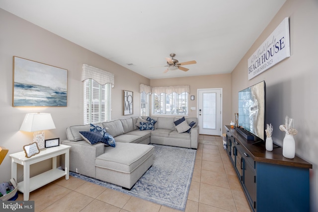 living area with light tile patterned flooring, visible vents, and a ceiling fan