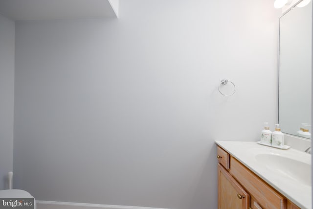 bathroom with baseboards and vanity