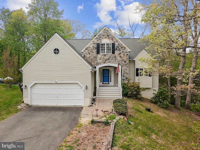 traditional-style home featuring stone siding, aphalt driveway, a shingled roof, and a garage