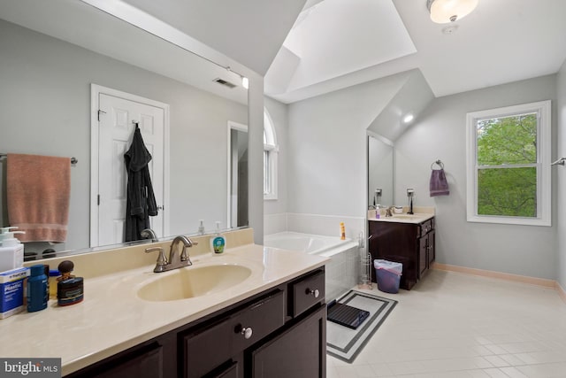 bathroom with two vanities, visible vents, a bath, and a sink