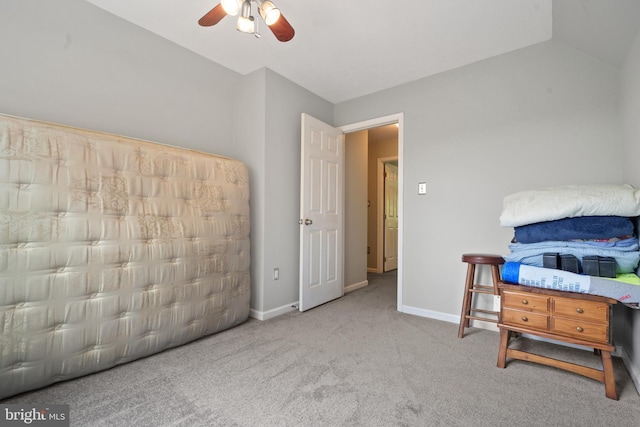 bedroom featuring carpet flooring, ceiling fan, vaulted ceiling, and baseboards