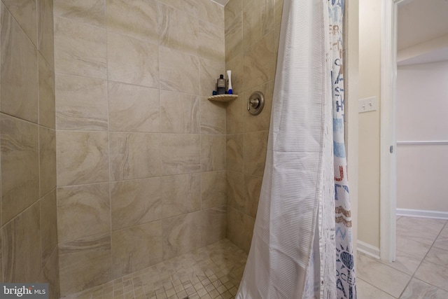 bathroom with tiled shower