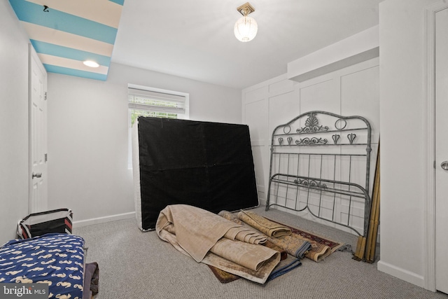 carpeted bedroom with baseboards
