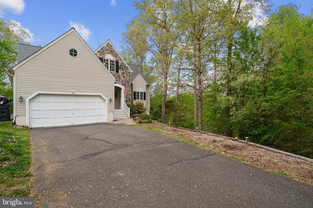 view of front of house with aphalt driveway
