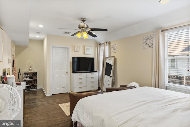 bedroom with visible vents, recessed lighting, dark wood-style floors, and multiple windows