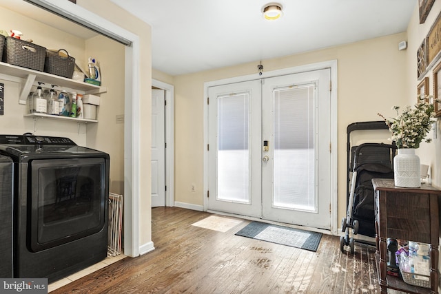 doorway featuring french doors, washer and clothes dryer, baseboards, and hardwood / wood-style flooring